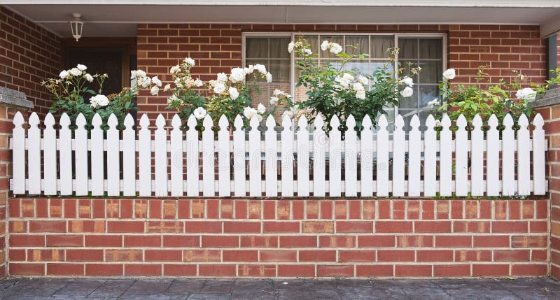 Entrance with white fence