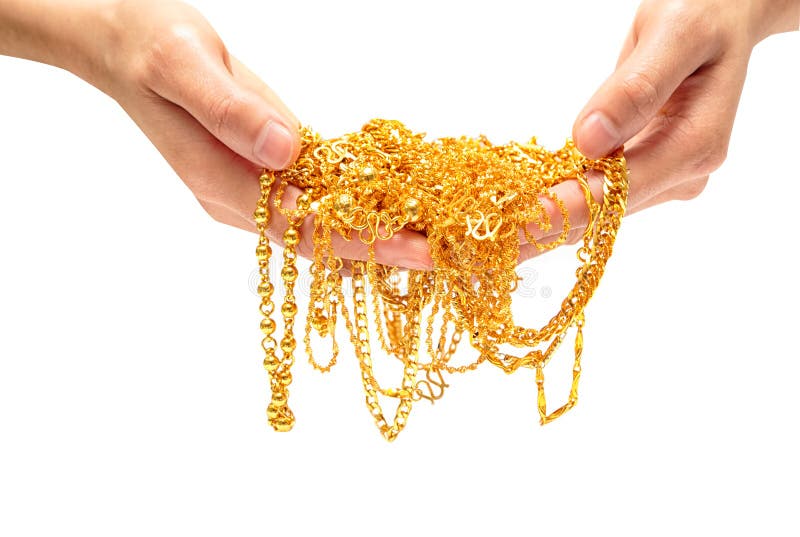 Entregue guardar a colar e o bracelete caros da joia do ouro fotos de stock Entregue guardar a colar e o bracelete caros da joia do ouro fotos de stock