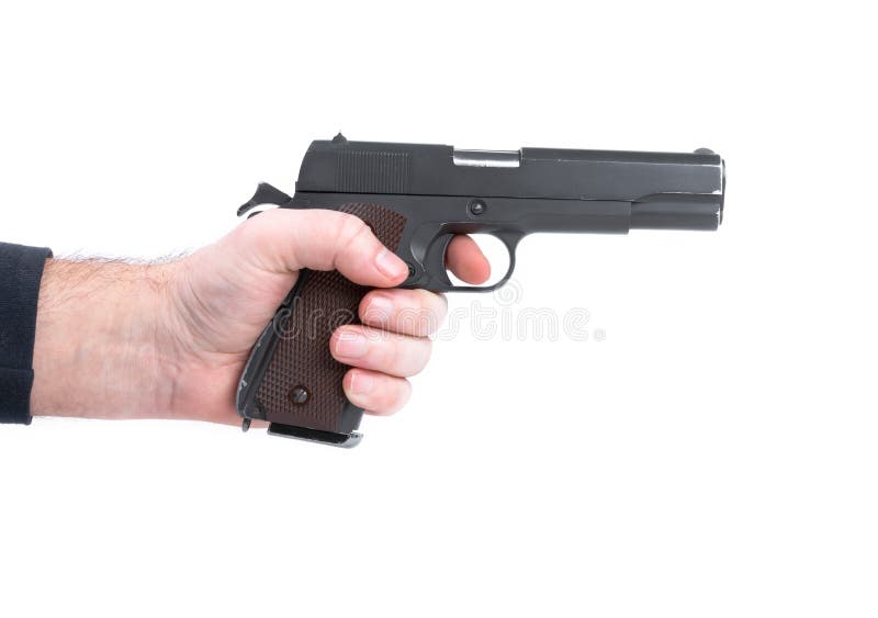 Entregue manter o revólver da pistola isolado no fundo branco fotografia de stock Entregue manter o revólver da pistola isolado no fundo branco fotografia de stock