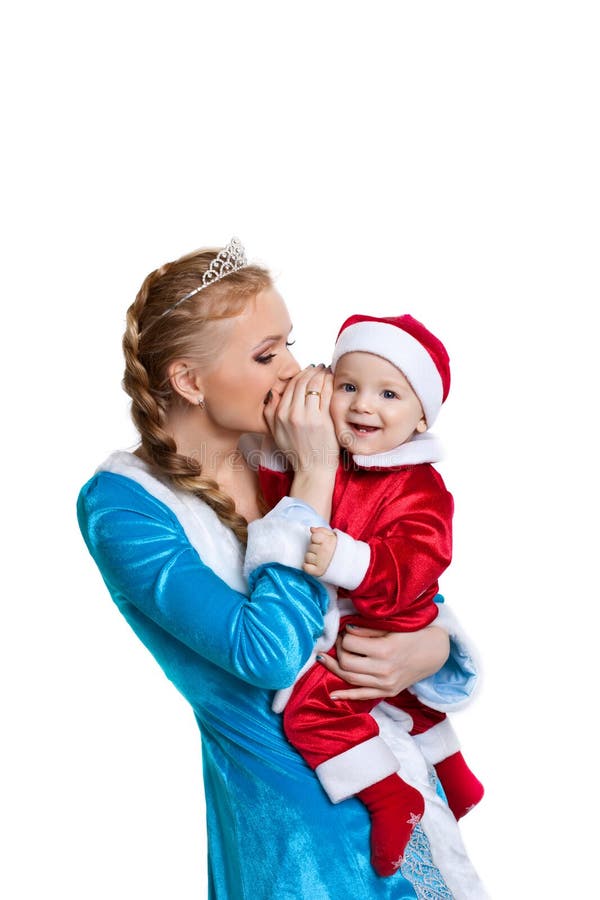Entretien de fille de Noël un secret à la chéri le père noël photographie stock libre de droits Entretien de fille de Noël un secret à la chéri le père noël photographie stock libre de droits