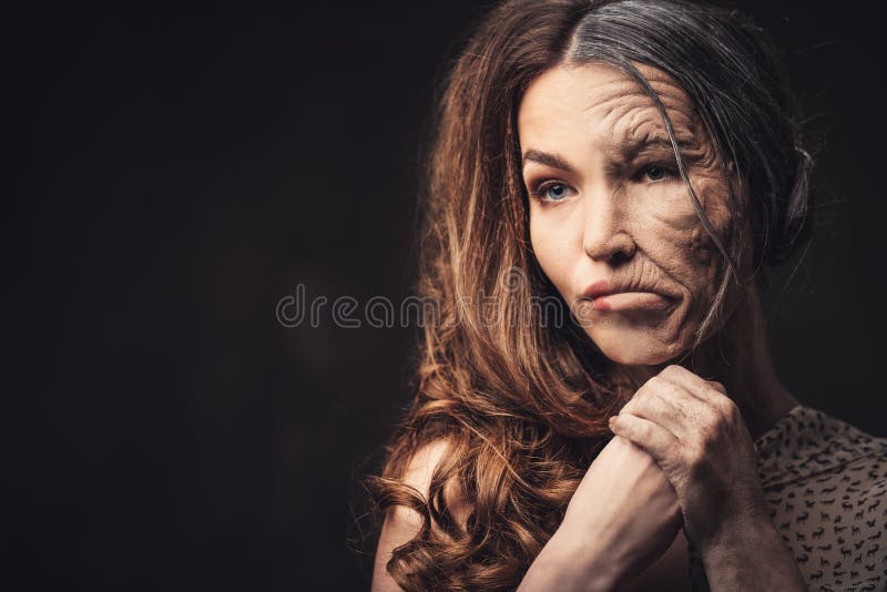 Aging and skin care concept. Half old half young woman. Aging and skin care concept. Half old half young woman.