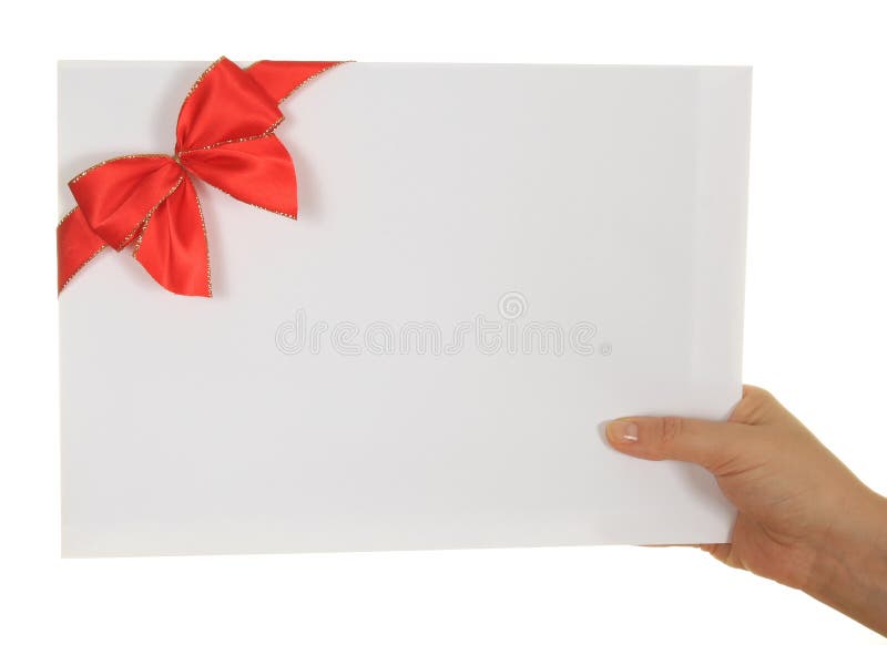 Envelope with red ribbon in hand stock image