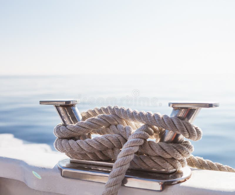 Ship`s ropes on the yacht in Ligurian Sea, Italy. Close-up of a mooring rope. Ship`s ropes on the yacht in Ligurian Sea, Italy. Close-up of a mooring rope