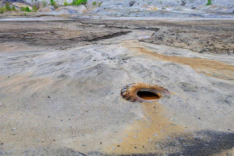 Environmental Debris Pollution, Old Car Tires and Liquid Mud in the