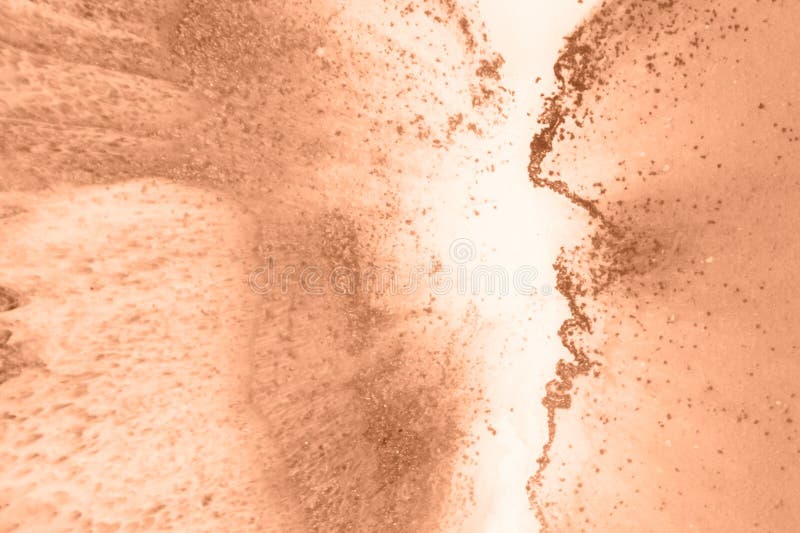 Epoxy resin paint, abstract background. Demonstrating the colors of 2024 - Peach Fuzz. royalty free stock image