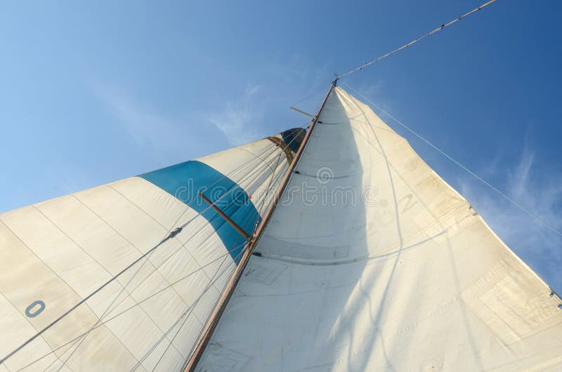Old boat standing and running rigging - mainsail,staysaill,mast and crosspieces and backstays. Old boat standing and running rigging - mainsail,staysaill,mast and crosspieces and backstays