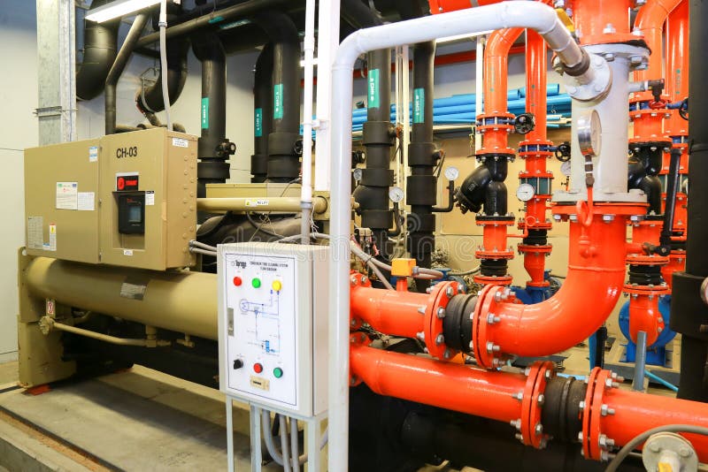 Equipment, cables and piping as found inside of industrial chiller plant room