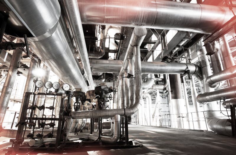 Equipment, cables and piping as found inside of a modern industrial power plant