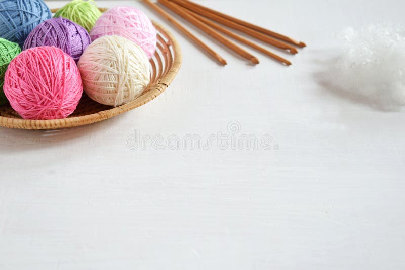 Equipment for knitting and crochet hook, colorful rainbow cotton yarn, ball of threads, wool. Handmade crocheting crafts. DIY concept. Copy space. Equipment for knitting and crochet hook, colorful rainbow cotton yarn, ball of threads, wool. Handmade crocheting crafts. DIY concept. Copy space