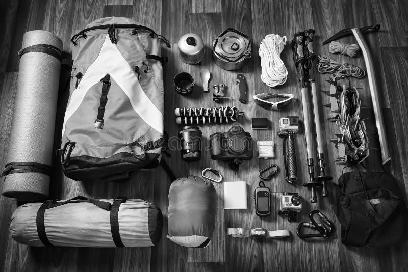 Equipment necessary for mountaineering and hiking on wooden background royalty free stock photo Equipment necessary for mountaineering and hiking on wooden background royalty free stock photo