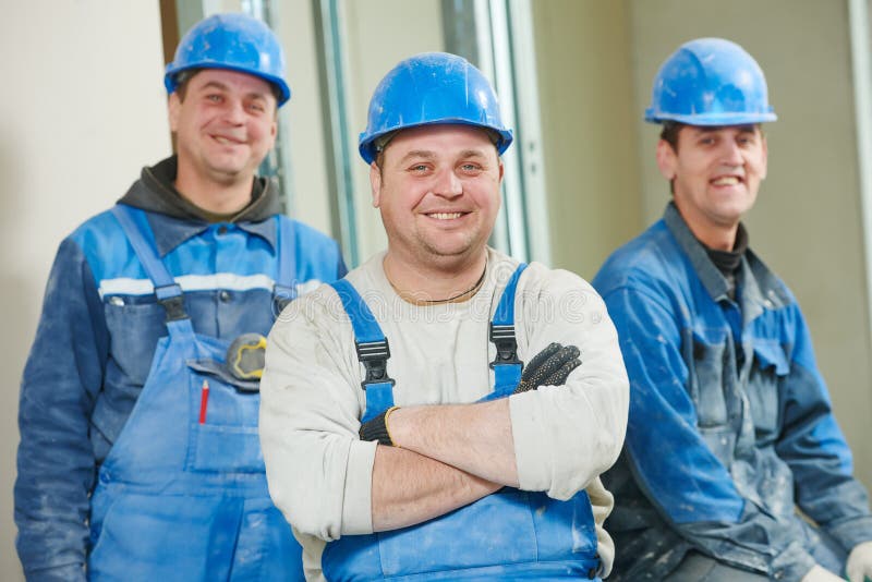 Equipo de los trabajadores de construcción fotografía de archivo libre de regalías Equipo de los trabajadores de construcción fotografía de archivo libre de regalías