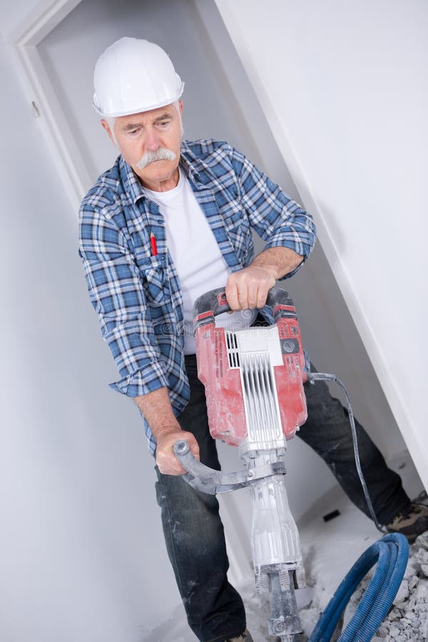 Erbauerarbeitskraft mit pneumatischem Bohrhammer lizenzfreie stockfotografie Erbauerarbeitskraft mit pneumatischem Bohrhammer lizenzfreie stockfotografie
