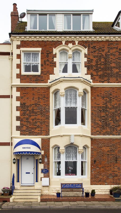Erdgeschossfassade eines Anfang- des 19. Jahrhundertshauses, Dorset, auf der Südküste von lizenzfreies stockbild Erdgeschossfassade eines Anfang- des 19. Jahrhundertshauses, Dorset, auf der Südküste von lizenzfreies stockbild