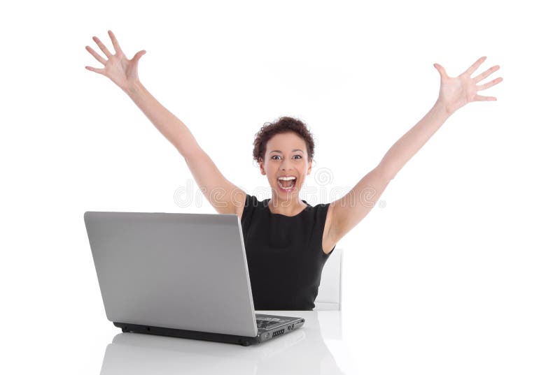 Ecstatic pretty woman sitting at desk with laptop and stretched out arms isolated on white background. Ecstatic pretty woman sitting at desk with laptop and stretched out arms isolated on white background