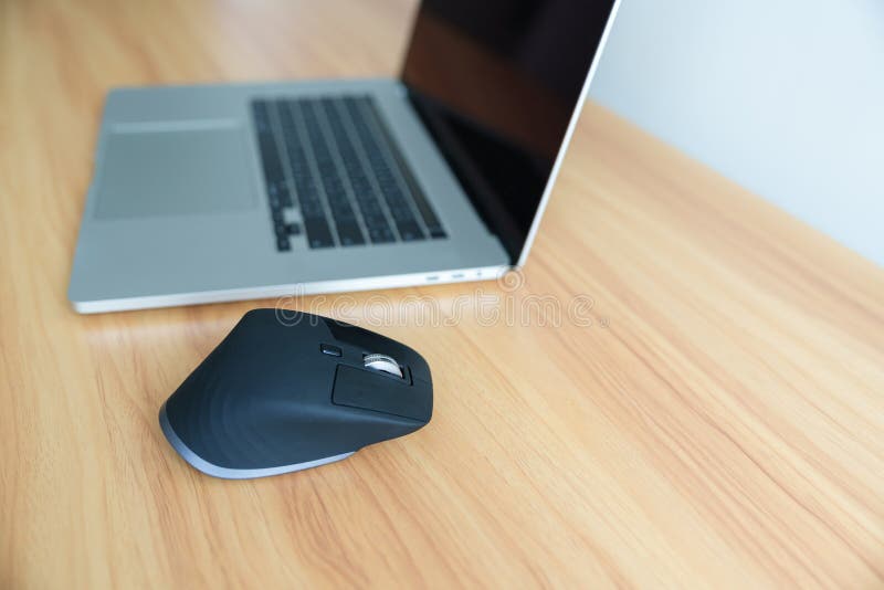 Ergonomic Vertical Mouse with Laptop Computer on Adjustable Desk at