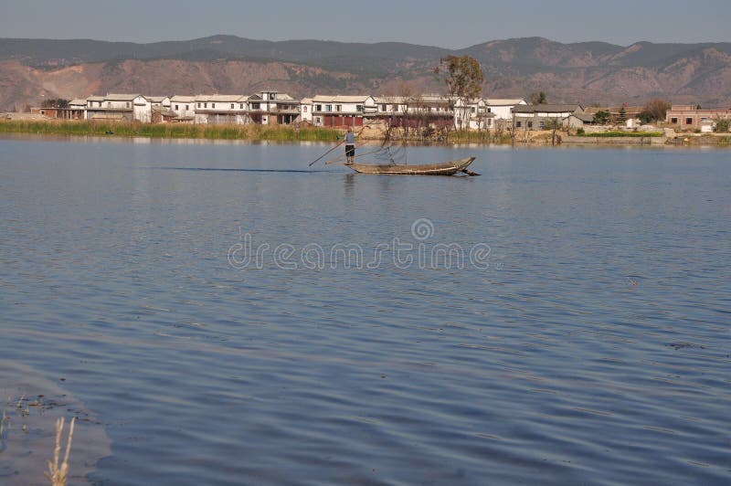 Erhai Lake in Yunnan, China fishing boat peopleï¼Œand Residential lake