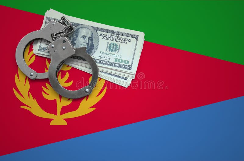 Eritrea flag with handcuffs and a bundle of dollars. The concept of breaking the law and thieves crimes stock photo