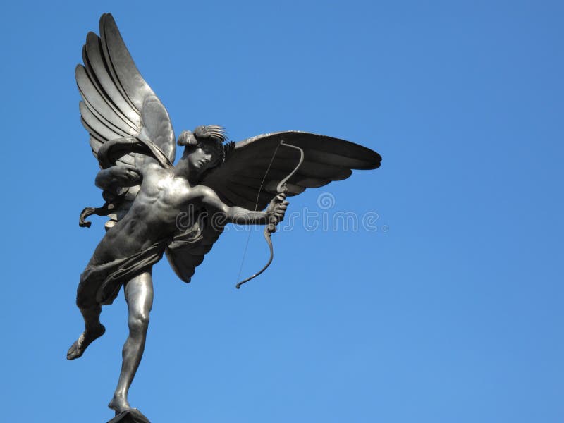 The aluminium statue of Eros the greek mythological God Of Love, stands at the top of The Shaftesbury Memorial Fountain in London's Piccadilly Circus. The aluminium statue of Eros the greek mythological God Of Love, stands at the top of The Shaftesbury Memorial Fountain in London's Piccadilly Circus