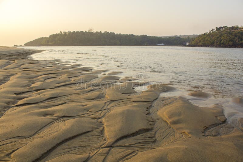 A erosion of the sandy shore by the water on the background of the river royalty free stock photos A erosion of the sandy shore by the water on the background of the river royalty free stock photos