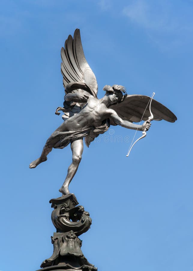 Eros statue at Piccadilly Circus in London on blue sky. Eros statue at Piccadilly Circus in London on blue sky