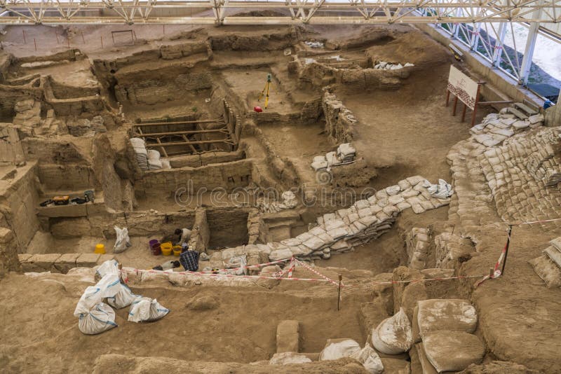 Cumra, Konya/Turkey June 1 2016: Built in 7500 B.C. Catalhoyuk is the oldest settlement in the world. Neolithic and Chalcolithic period. Historic and archaeological area. Cumra, Konya/Turkey June 1 2016: Built in 7500 B.C. Catalhoyuk is the oldest settlement in the world. Neolithic and Chalcolithic period. Historic and archaeological area.