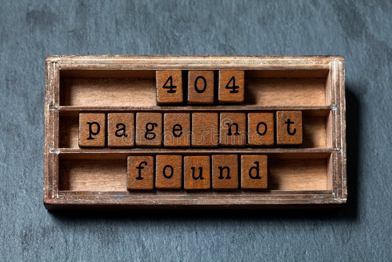 Error 404 page not found concept. Vintage box, wooden cubes with old style letters. Gray stone textured background royalty free stock photo Error 404 page not found concept. Vintage box, wooden cubes with old style letters. Gray stone textured background royalty free stock photo