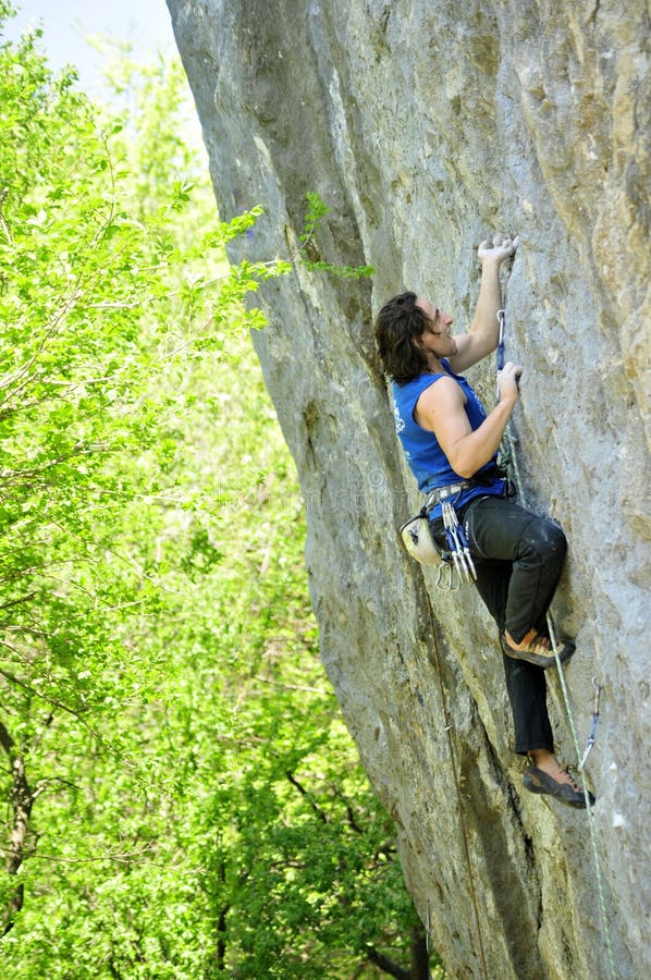 Young male is climbing a hard route in Crimea, Ukraine. Young male is climbing a hard route in Crimea, Ukraine