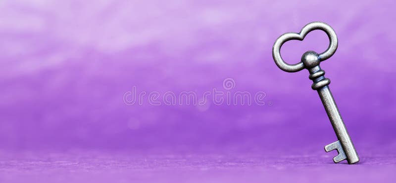 Escape room concept. Vintage key on purple background, web banner