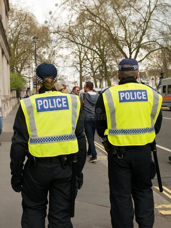 Escolta Policial - Marcha de Protesta - Londres imágenes de archivo libres de regalías