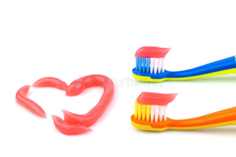 Escovas de dentes com dentífrico cor-de-rosa fotografia de stock Escovas de dentes com dentífrico cor-de-rosa fotografia de stock