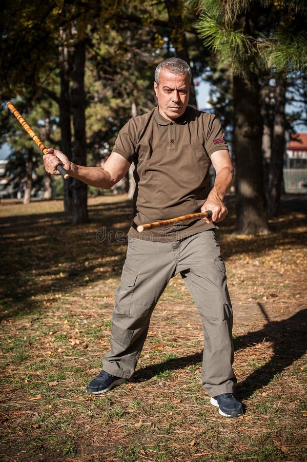 Filipino Martial Arts Instructor Demonstrates Stick Fighting Techniques  Stock Photo - Image of astig, outdoor: 109278684