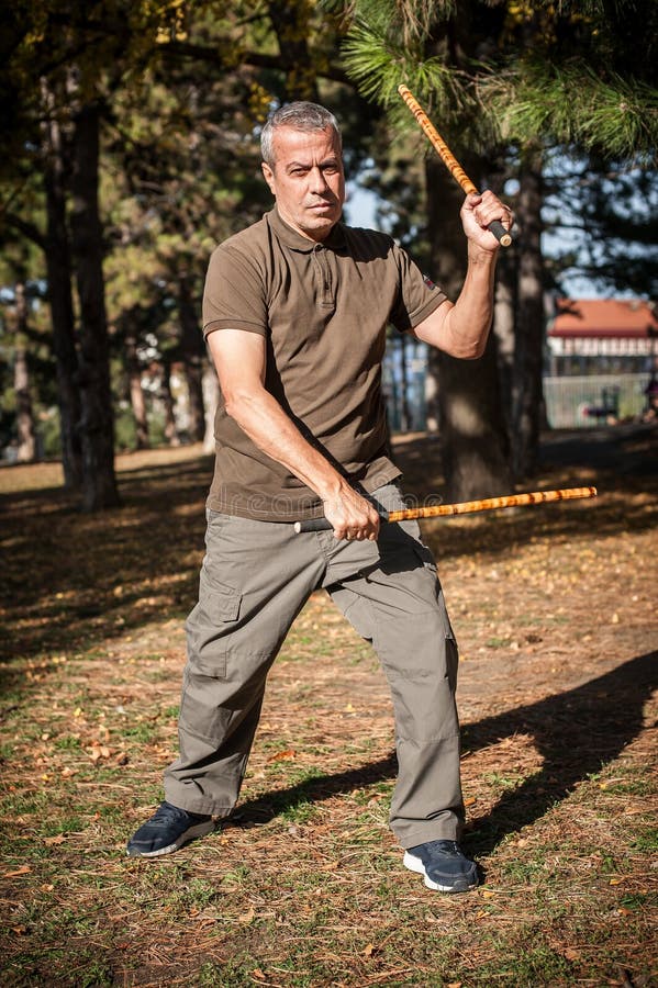 Filipino Martial Arts Instructor Demonstrates Stick Fighting Techniques  Stock Photo - Image of astig, outdoor: 109278684