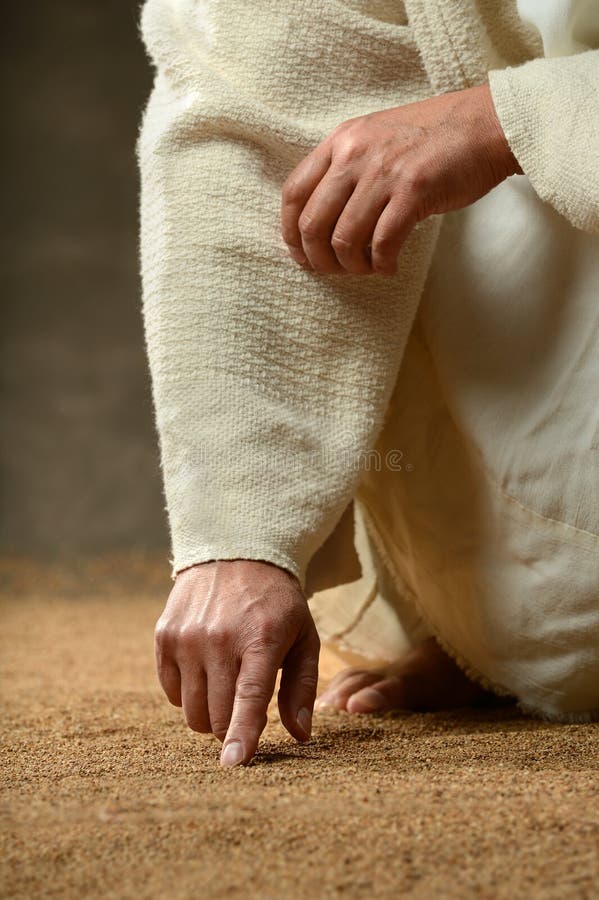 Escrita do dedo de Jesus na areia