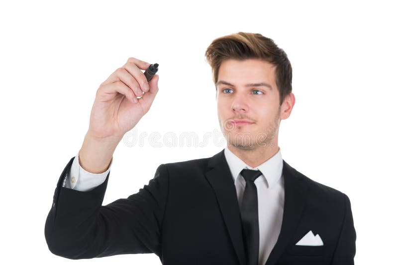 Escrita do homem de negócios na tela transparente fotografia de stock Escrita do homem de negócios na tela transparente fotografia de stock