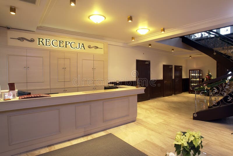 A view of a modern hotel reception desk and lobby. A view of a modern hotel reception desk and lobby.