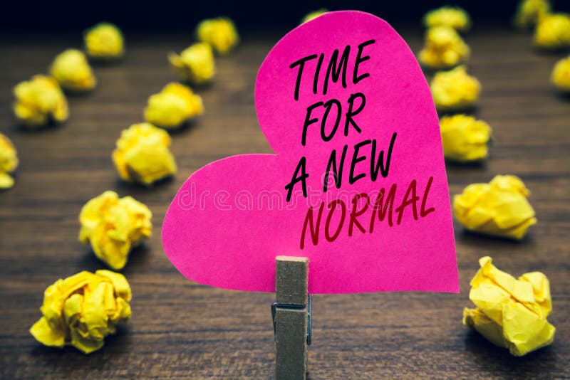 Conceptual hand writing showing Time For A New Normal. Business photo text Make a big dramatic change Replace the expected Paperclip hold pink written heart woody floor with yellow lobs. Conceptual hand writing showing Time For A New Normal. Business photo text Make a big dramatic change Replace the expected Paperclip hold pink written heart woody floor with yellow lobs