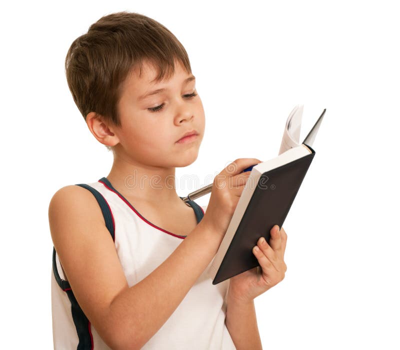 Escritura del niño pensativo imagenes de archivo Escritura del niño pensativo imagenes de archivo