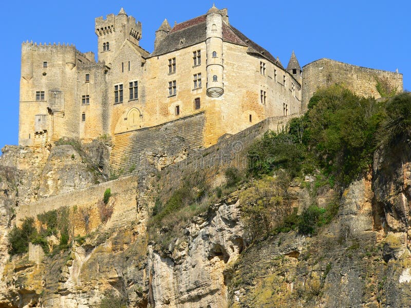 View of castle Beynac in Dordogne in the Black Perigord built on the edge of the cliff. View of castle Beynac in Dordogne in the Black Perigord built on the edge of the cliff