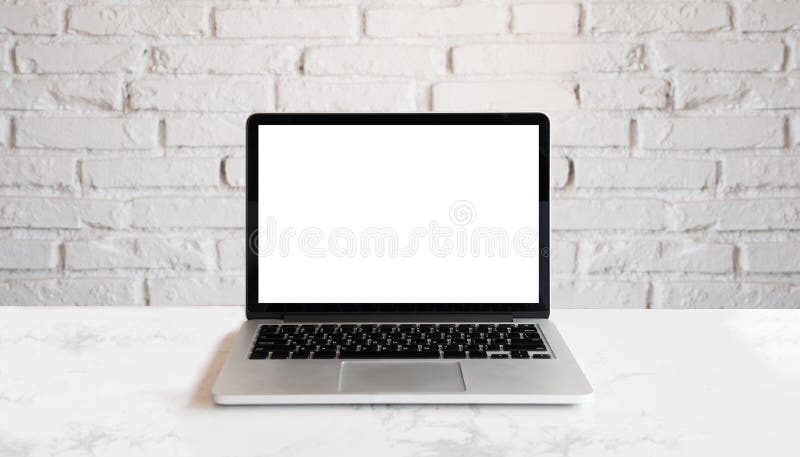 Conceptual workspace, Laptop computer with blank white screen. Mock up laptop on wood table and white brick wall. Conceptual workspace, Laptop computer with blank white screen. Mock up laptop on wood table and white brick wall