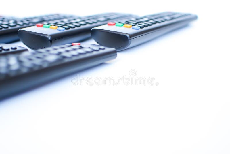 Especially heavily blurred black remote controls for the TV on a white background royalty free stock images Especially heavily blurred black remote controls for the TV on a white background royalty free stock images