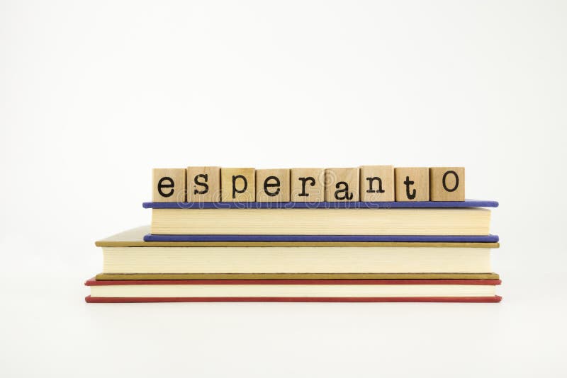 Esperanto language word on wood stamps and books royalty free stock photos