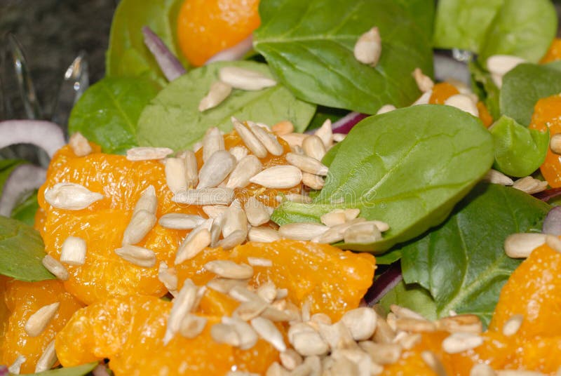 Spinach & mandarin orange salad with toasted sunflower seeds. Spinach & mandarin orange salad with toasted sunflower seeds