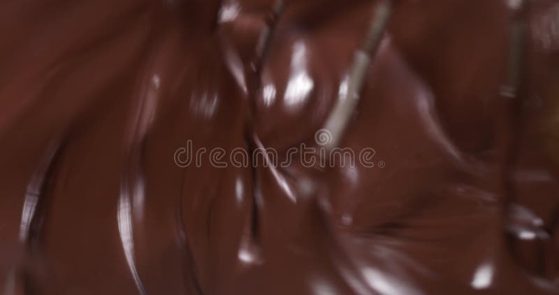 Espiral abstrata de chocolate brilhante em movimento borrão