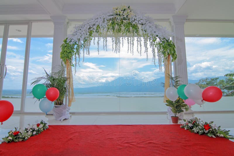 The wedding proposal decoration is ready to be held with a clear glass background featuring views of Rawa Pening lake and the mountains of Semarang, Indonesia on December 17, 2016. The wedding proposal decoration is ready to be held with a clear glass background featuring views of Rawa Pening lake and the mountains of Semarang, Indonesia on December 17, 2016.