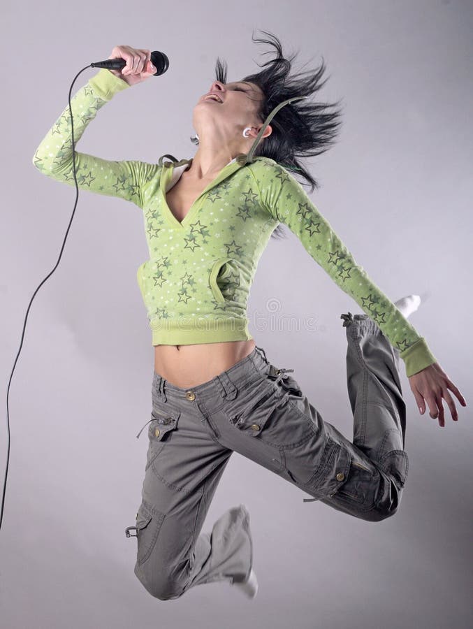 Young woman with microphone in air. Young woman with microphone in air