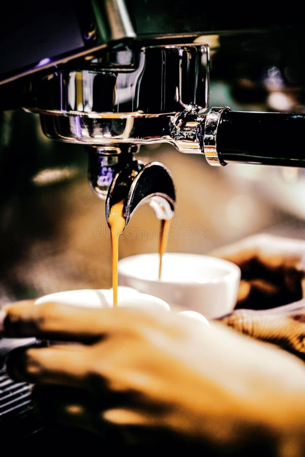 Espresso Machine Brewing a Coffee. Coffee Pouring into Glasses in