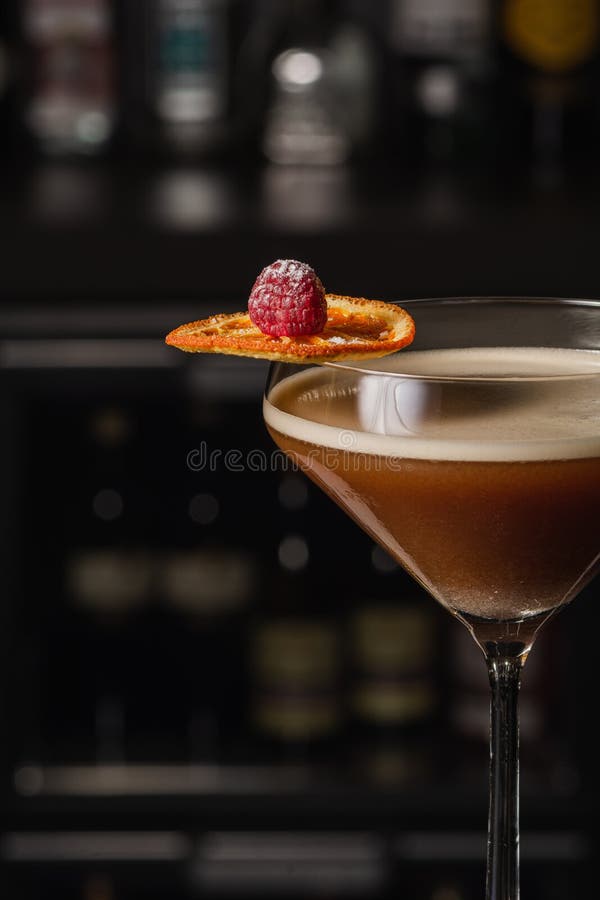 Espresso Martini Cocktail Based on Coffee, Liqueur and Vodka. Served with Orange Chips and