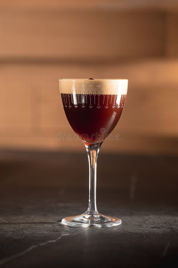Espresso martini cocktail in elegant glass stock photo