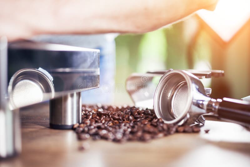 Espresso out of classic coffee machine into coffee cup