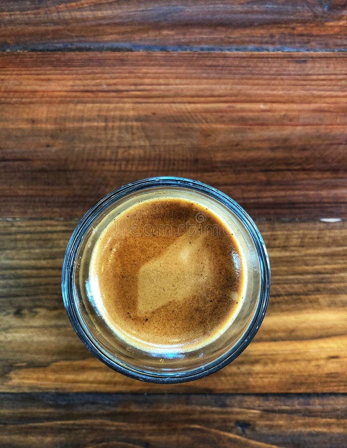Espresso Shot in Glass on the Vintage Wooden Table, Stock Photo - Image of  closeup, energy: 113794682